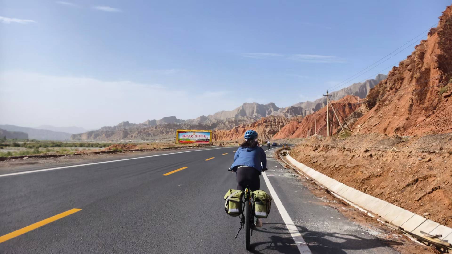 Cycling along a mountain road with touring bags